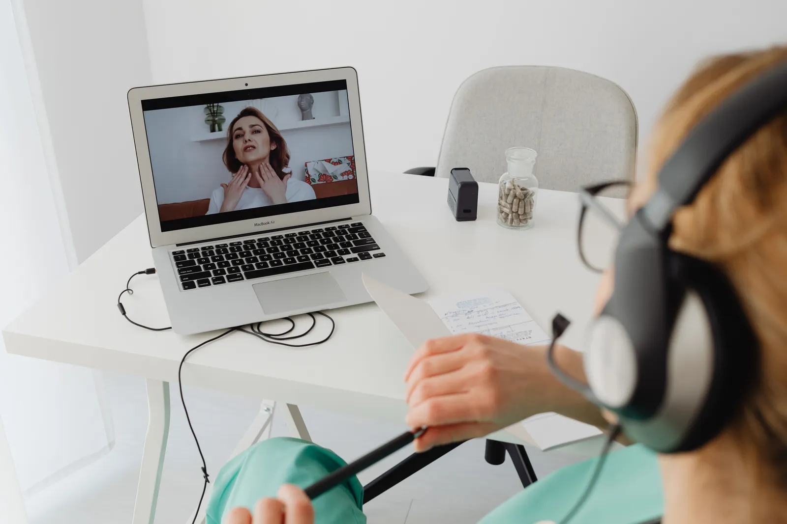 A person speaking with a qualified Australian practitioner by video