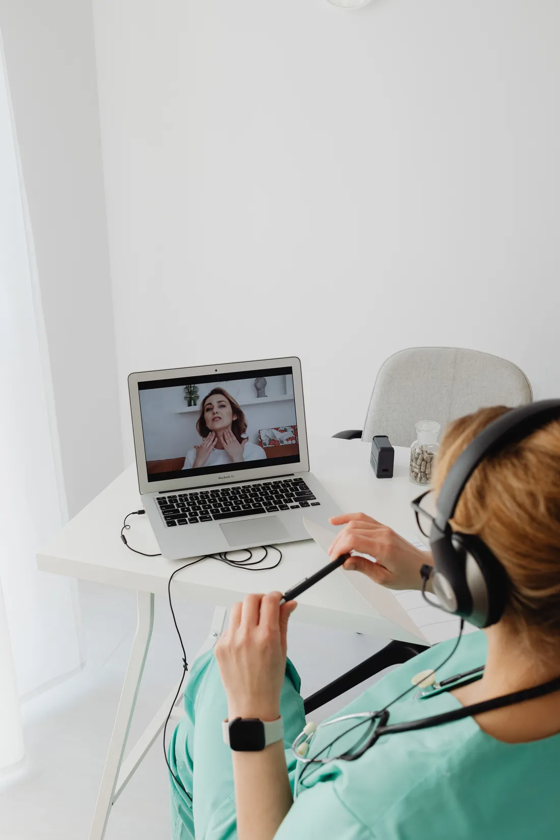 A practitioner speaking with a patient during a video consultation